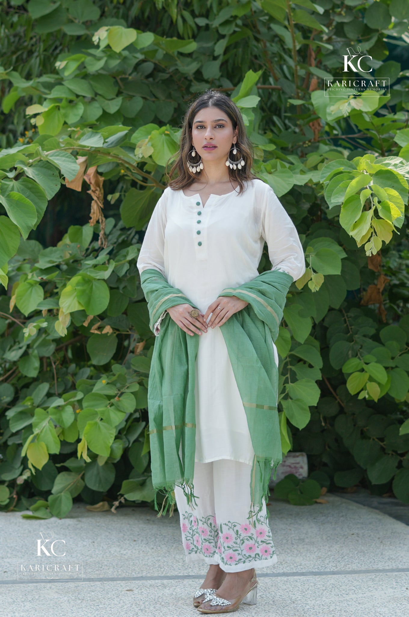 Front view of Muslin Light Ivory Chikankari Kurta Set with Dupatta