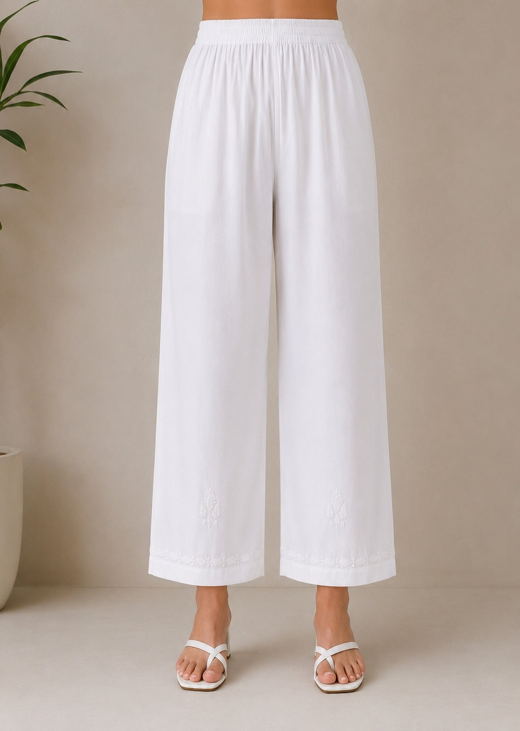 White chikankari rayon trousers by Karicraft