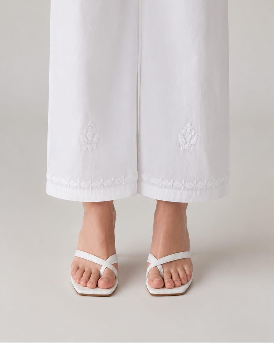 White chikankari rayon trousers by Karicraft